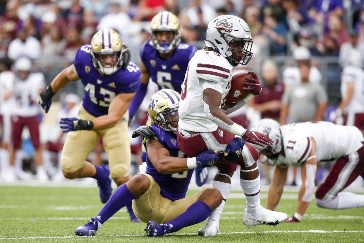Kyler Gordon tackles Montana's Xavier Harris.