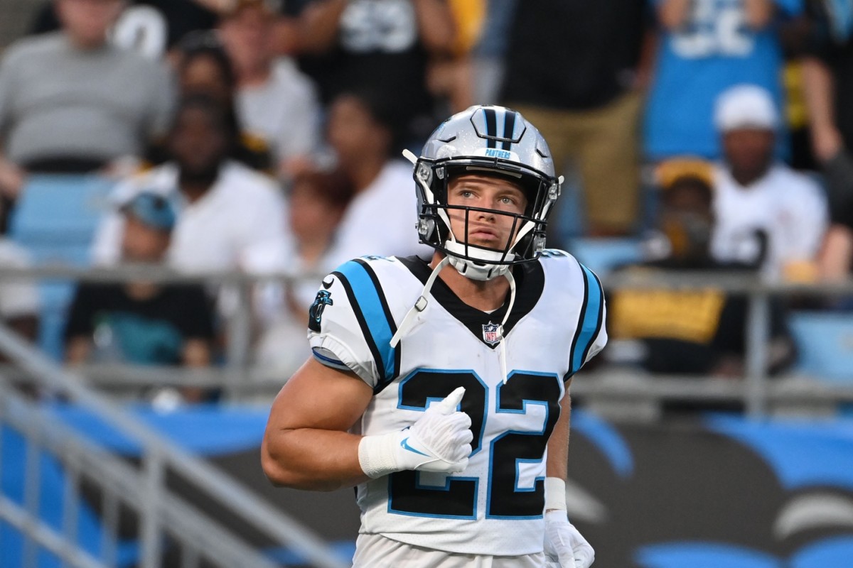 Carolina Panthers running back Christian McCaffrey (22) runs out of the tunnel ahead of a matchup with the Pittsburgh Steelers.
