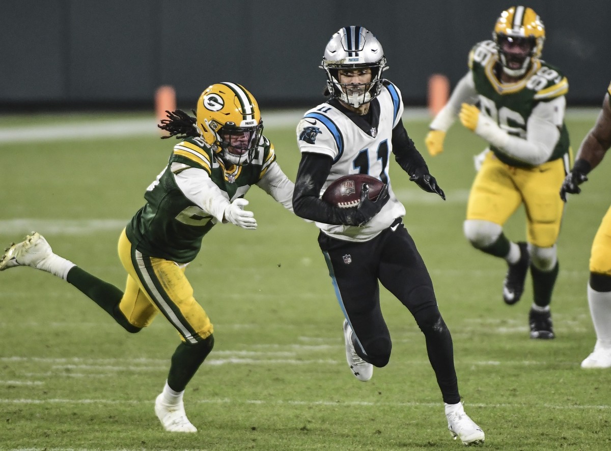 Carolina Panthers wide receiver Robby Anderson (11) carries the ball against Green Bay Packers cornerback Kevin King (20) in the third quarter at Lambeau Field.