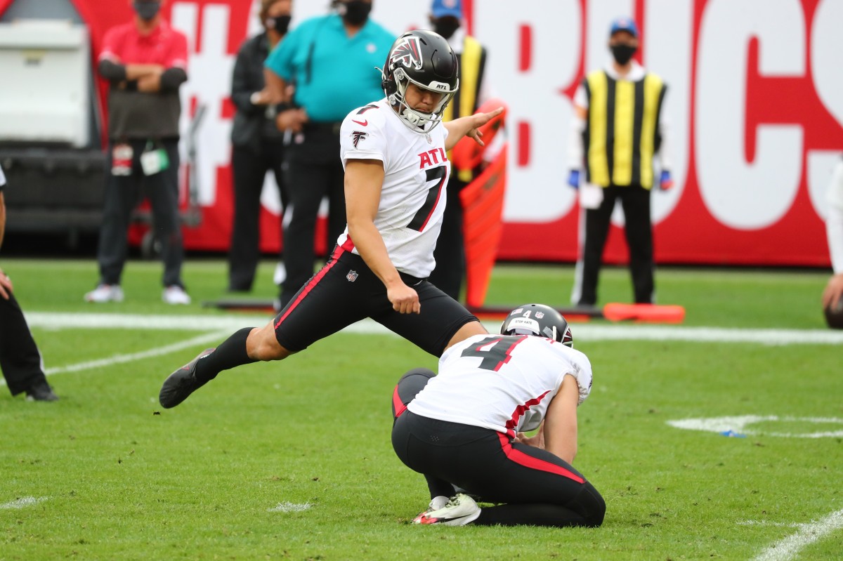 Atlanta Falcons kicker Younghoe Koo (7) makes a field goal as punter Sterling Hofrichter (4) holds bathe ball against the Tampa Bay Buccaneers during the second half at Raymond James Stadium.