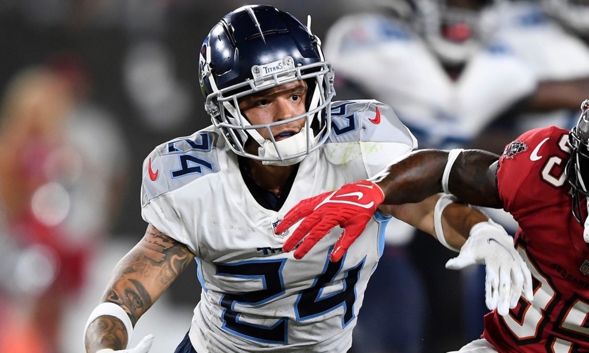 Tennessee Titans cornerback Elijah Molden (24) breaks up a pass intended for Tampa Bay Buccaneers wide receiver Jaydon Mickens (85) during the fourth quarter of an NFL preseason game at Raymond James Stadium Saturday, Aug. 21, 2021 in Tampa, Fla.