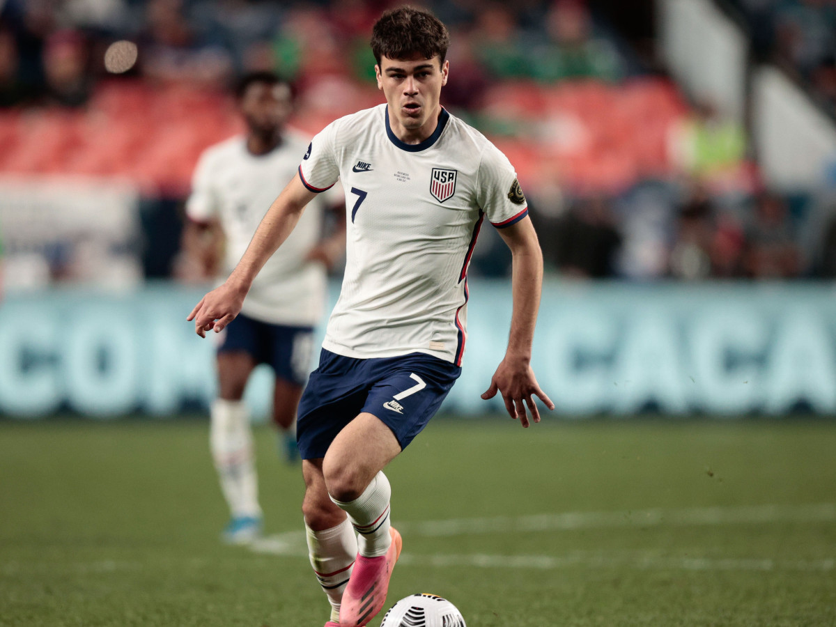 United States forward Gio Reyna (7) controls the ball in the second half against Mexico during the 2021 CONCACAF Nations League Finals soccer series final match at Empower Field at Mile High.