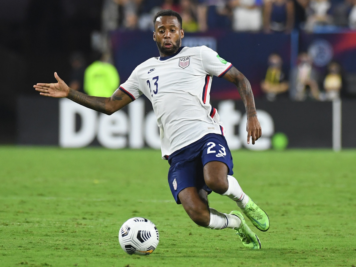 United States midfielder Kellyn Acosta (23) plays the ball in the second half against Canada during a CONCACAF FIFA World Cup Qualifier soccer match at Nissan Stadium.
