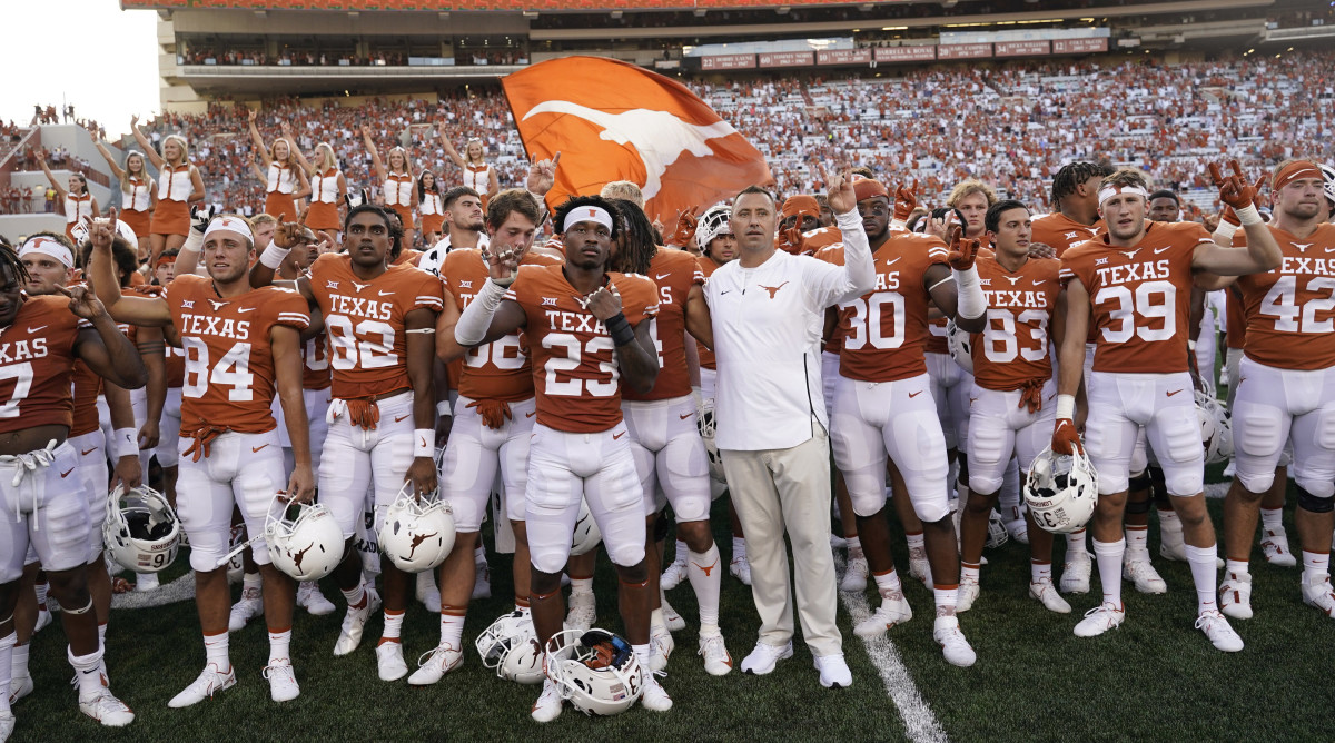 Texas football players sing The Eyes of Texas.