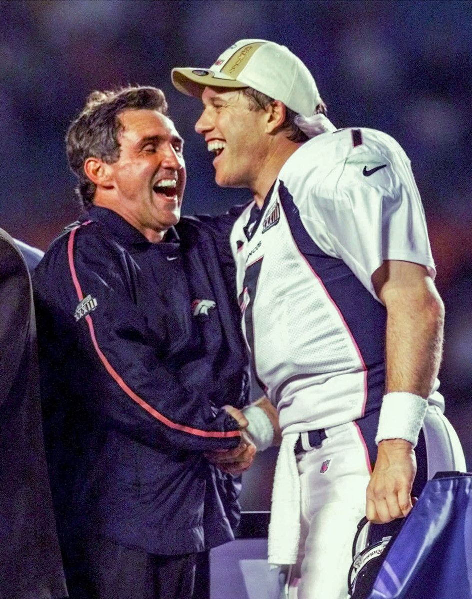 Mike Shanahan and John Elway celebrate after defeating the Falcons in Super Bowl XXXIII