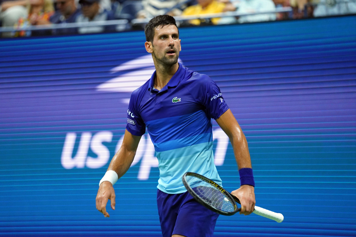 Novak Djokovic of Serbia looks to the crowd after winning a game at U.S. Open