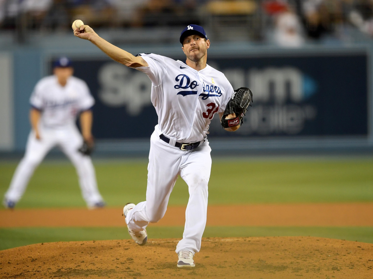 Sep 1, 2021; Los Angeles, California, USA;  Los Angeles Dodgers starting pitcher Max Scherzer (31) pitches in the third inning of the game against the Atlanta Braves at Dodger Stadium.