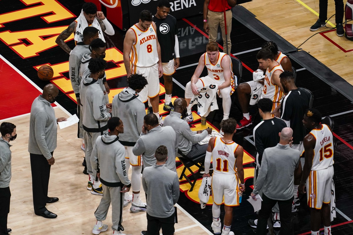 The Atlanta Hawks bench huddles during a time out against the Orlando Magic