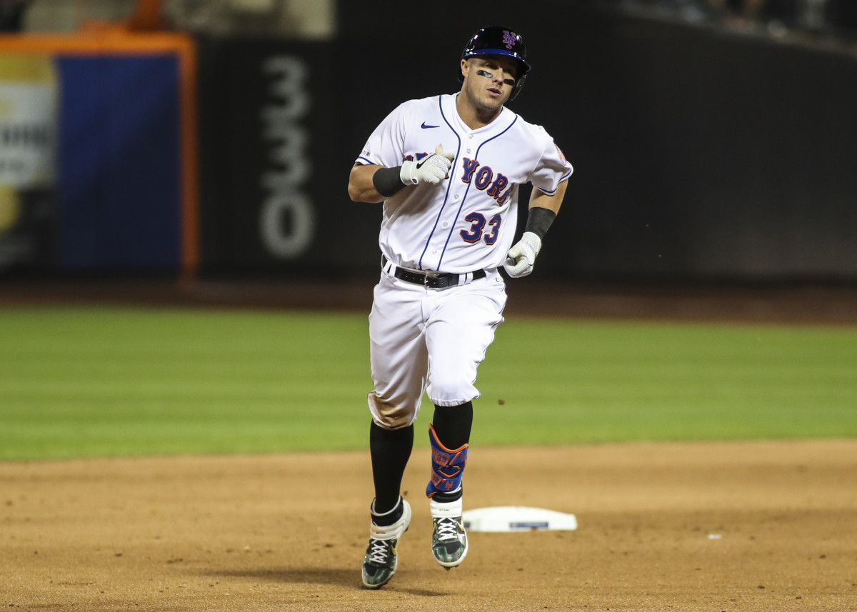 Sep 11, 2021; New York City, New York, USA; New York Mets catcher James McCann (33) rounds the bases after hitting a two run home run in the sixth inning against the New York Yankees at Citi Field.