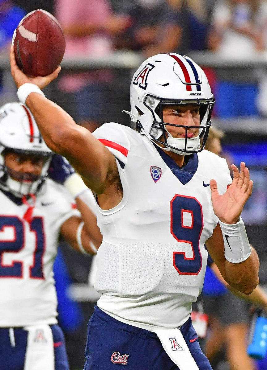 Arizona quarterback Gunner Cruz (9) throws a pass in warmups.