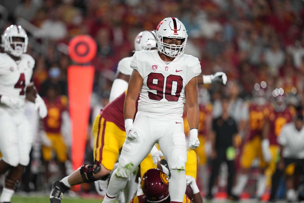 Stanford linebacker Gabe Reid (90) celebrates a tackle against USC.