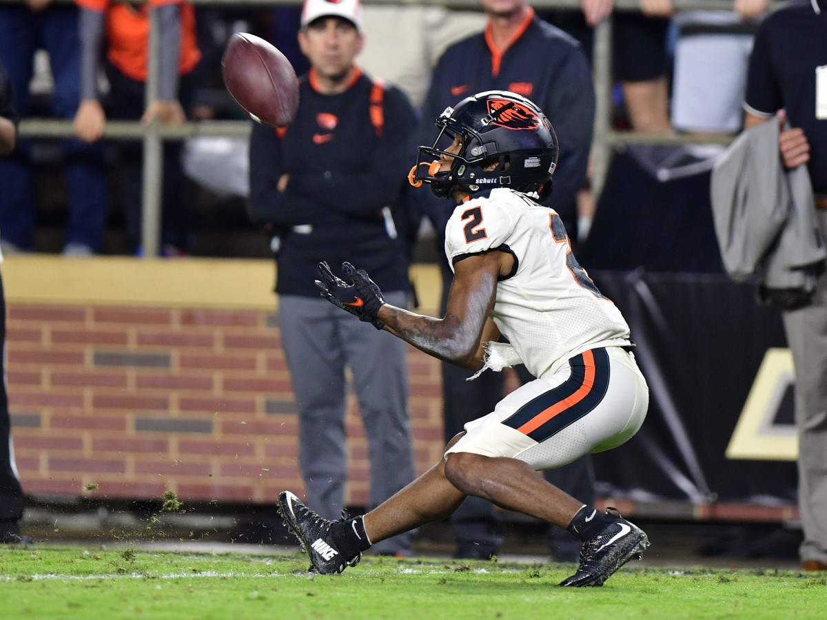 Oregon State wide receiver Champ Flemings (2) catches a long pass near the end zone.