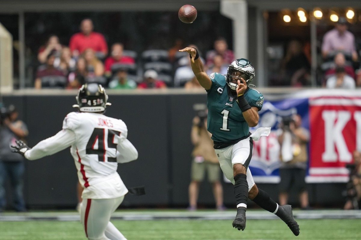 Jalen Hurts unleashes a throw on the run