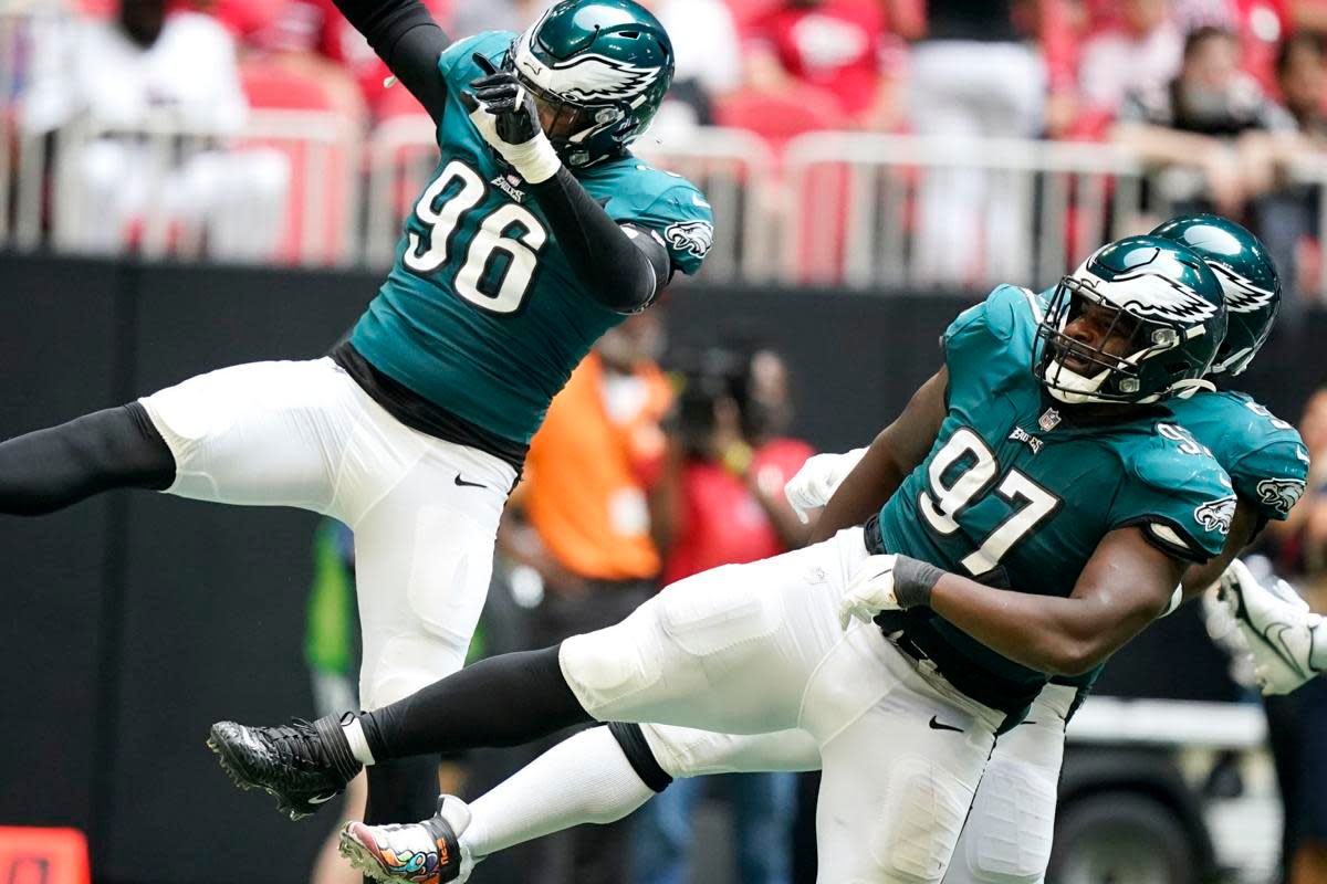 Derek Barnett (left) and Javon Hargrave celebrate a sack against the Falcons.