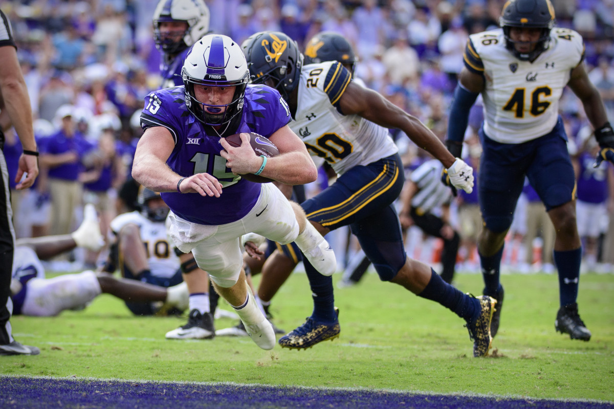 TCU Horned Frogs quarterback Max Duggan (15) dives into the end zone for the game-clinching touchdown against the California Golden Bears during the second half of the game at Amon G. Carter Stadium.