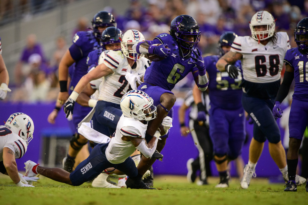 Sep 4, 2021; Fort Worth, Texas, USA; TCU Horned Frogs running back Zach Evans (6) runs for a first down against the Duquesne Dukes during the first quarter at Amon G. Carter Stadium.
