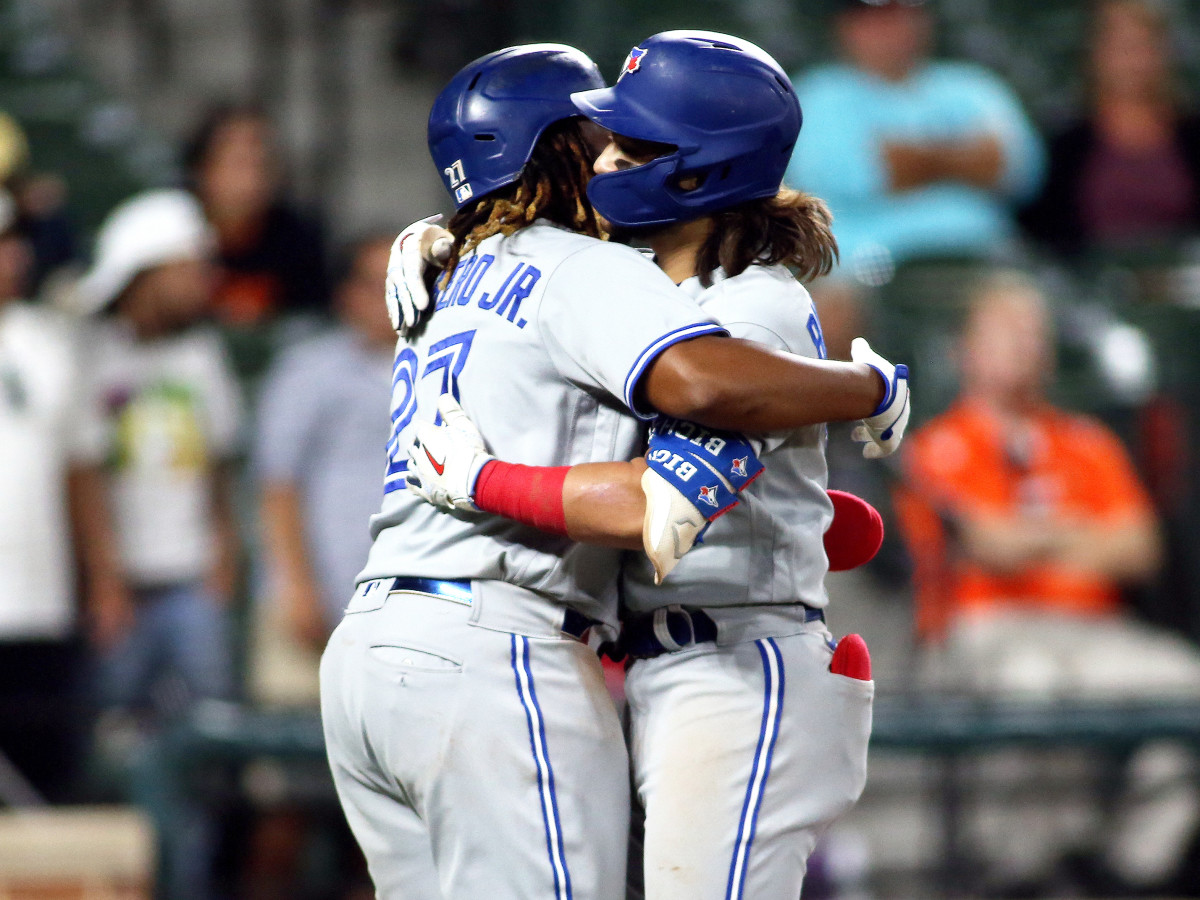 Sept. 11, 2021; Baltimore, Maryland, USA; Toronto Blue Jays designated hitter Vladimir Guerrero Jr. (27) celebrates with Toronto Blue Jays shortstop Bo Bichette (11) during the seventh inning against the Baltimore Orioles at Oriole Park at Camden Yards.