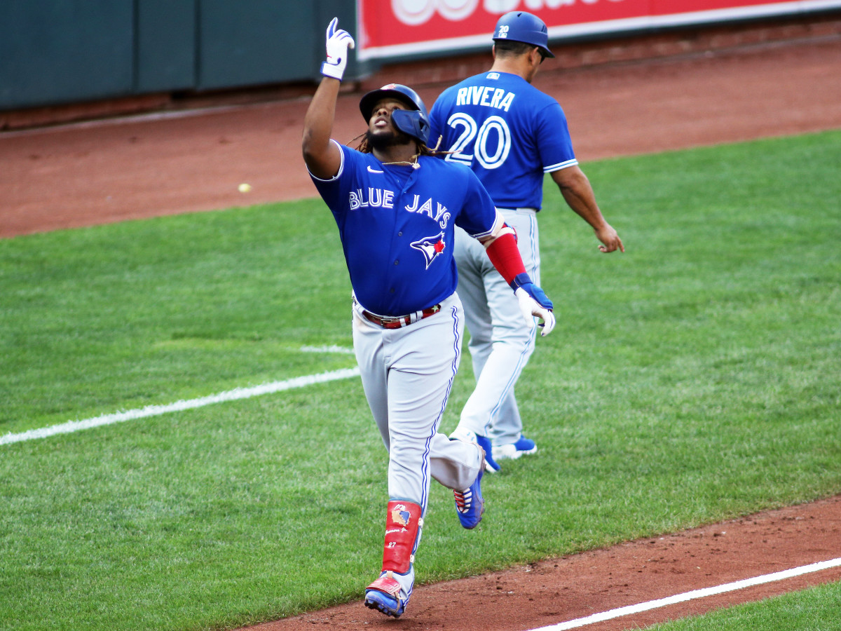 Sept. 11, 2021; Baltimore, Maryland, USA; Toronto Blue Jays designated hitter Vladimir Guerrero Jr. (27) hits a home run during the third inning against the Baltimore Orioles at Oriole Park at Camden Yards.