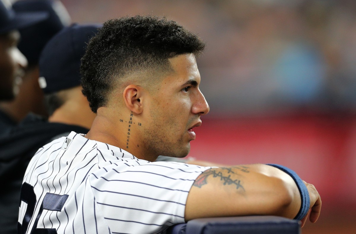 Gleyber Torres looking on from Yankees dugout