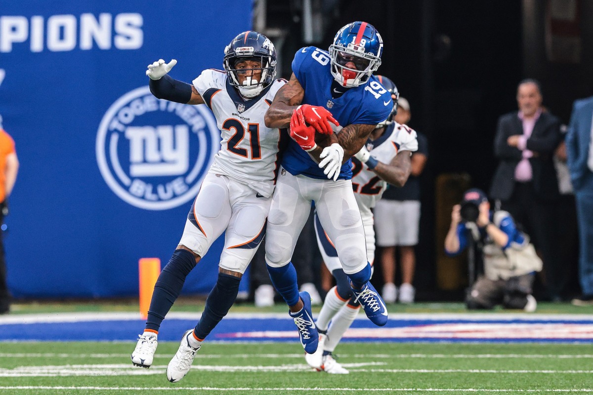 New York Giants wide receiver Kenny Golladay (19) catches the ball over Denver Broncos cornerback Ronald Darby (21) during the second half at MetLife Stadium.