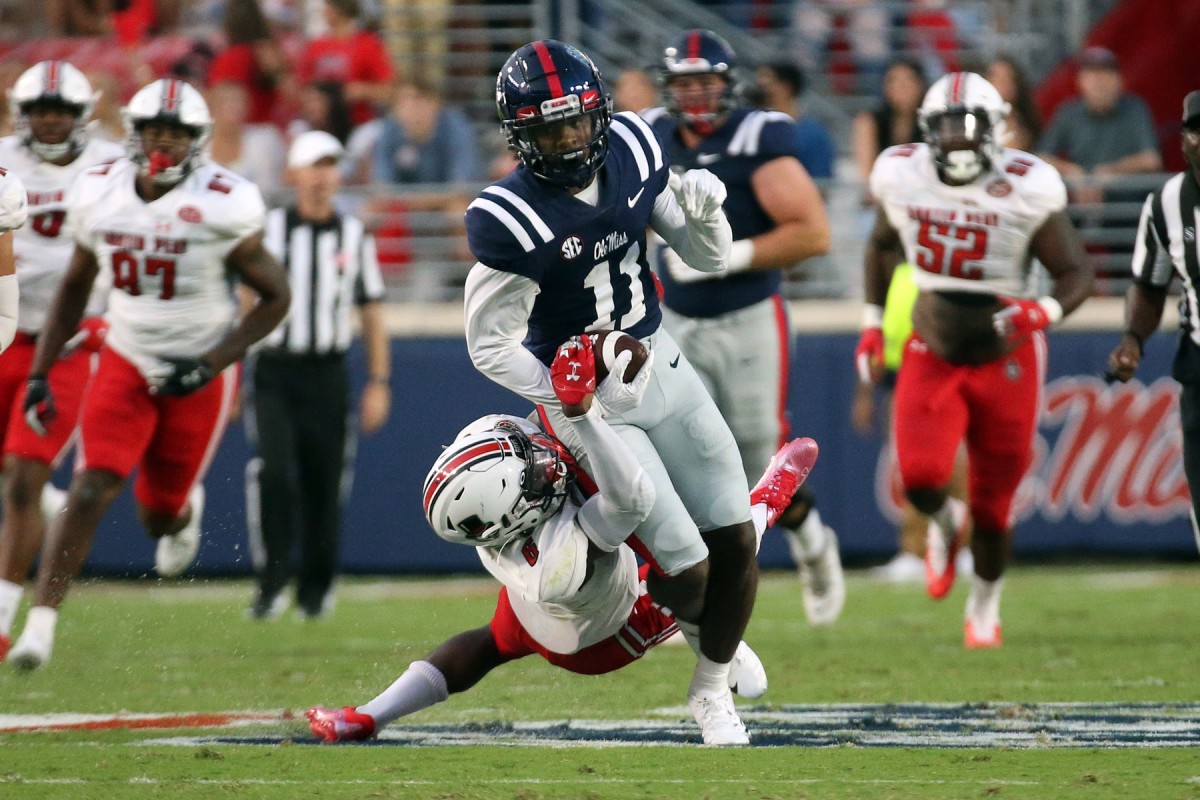 Sep 11, 2021; Oxford, Mississippi, USA; Mississippi Rebels wide receiver Dontario Drummond (11) runs the ball against Austin Peay Governors defensive back Kory Chapman (6) during the first quarter at Vaught-Hemingway Stadium.