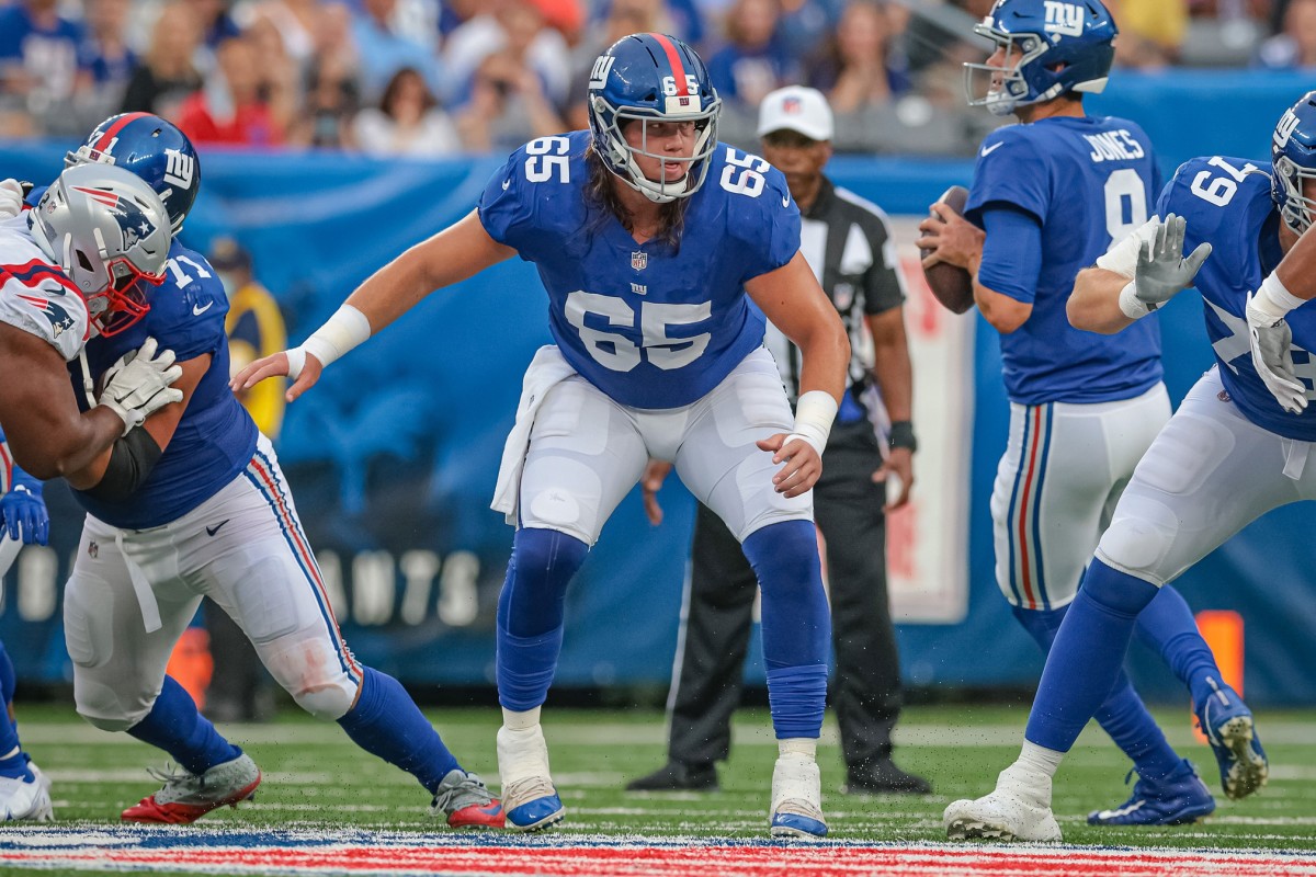 Aug 29, 2021; East Rutherford, New Jersey, USA; New York Giants center Nick Gates (65) blocks against the New England Patriots during the first half at MetLife Stadium.