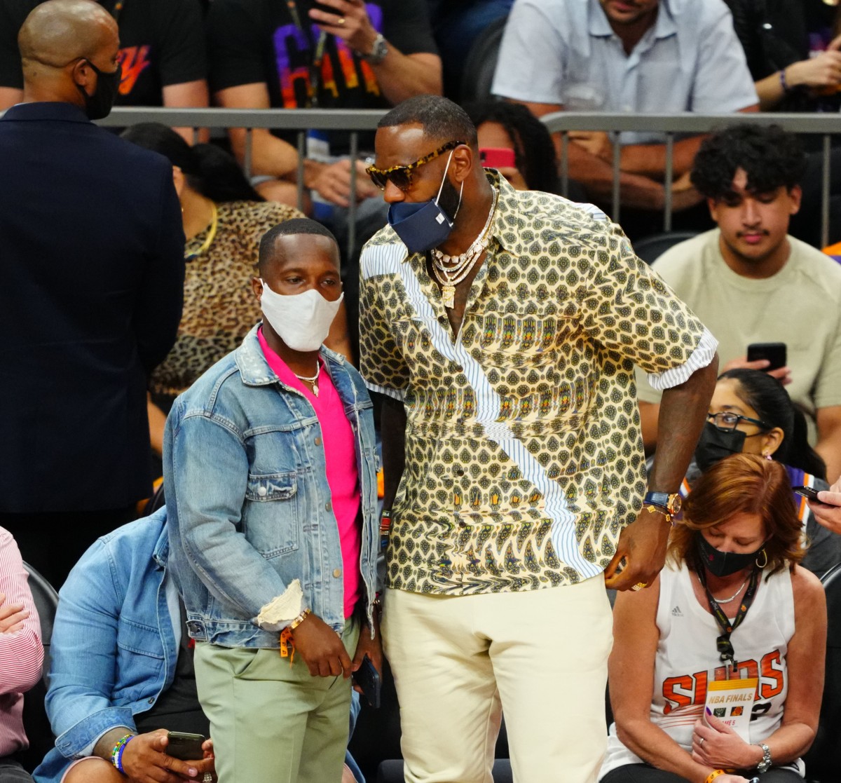 Los Angeles Lakers player LeBron James (right) with agent Rich Paul during game five of the 2021 NBA Finals. [Photo cropped so dimensions fit page]