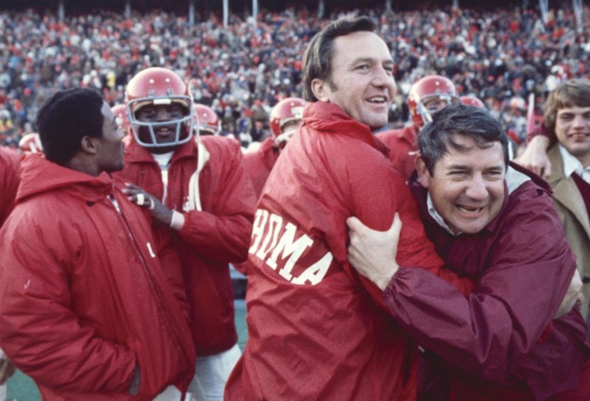 Chuck Fairbanks (center, after beating Nebraska in 1972)