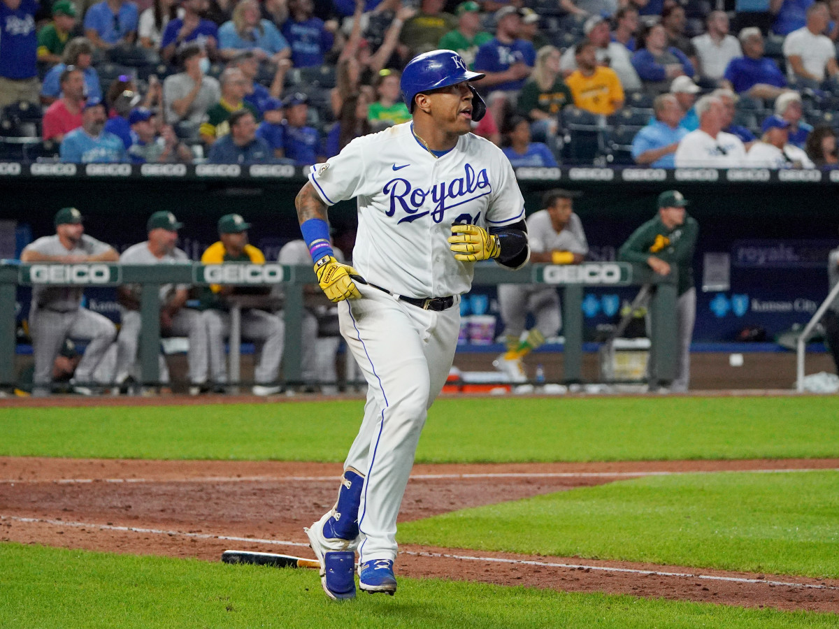 Sep 15, 2021; Kansas City, Missouri, USA; Kansas City Royals catcher Salvador Perez (13), wearing number 21, hits a solo home run against the Oakland Athletics in the fifth inning at Kauffman Stadium.