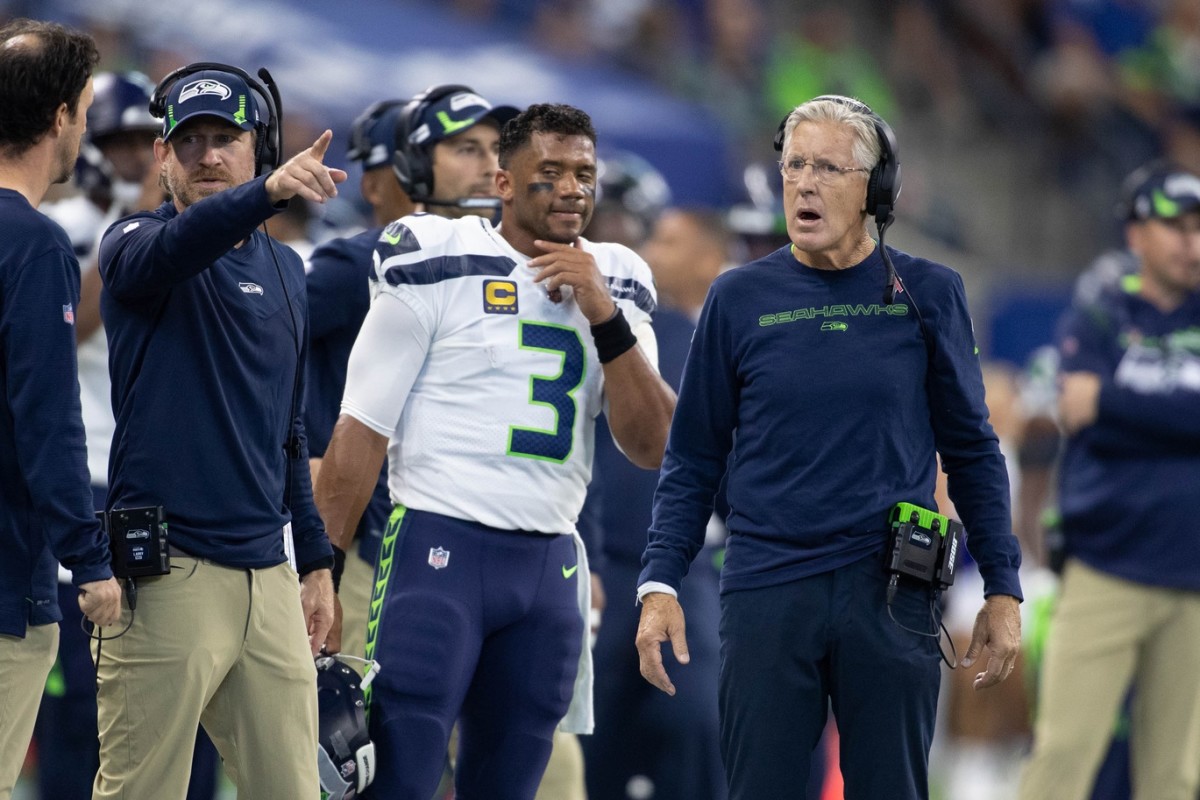 Seattle Seahawks quarterback Russell Wilson (3) and head coach Pete Carroll on the sideline in the first quarter against the Indianapolis Colts at Lucas Oil Stadium.