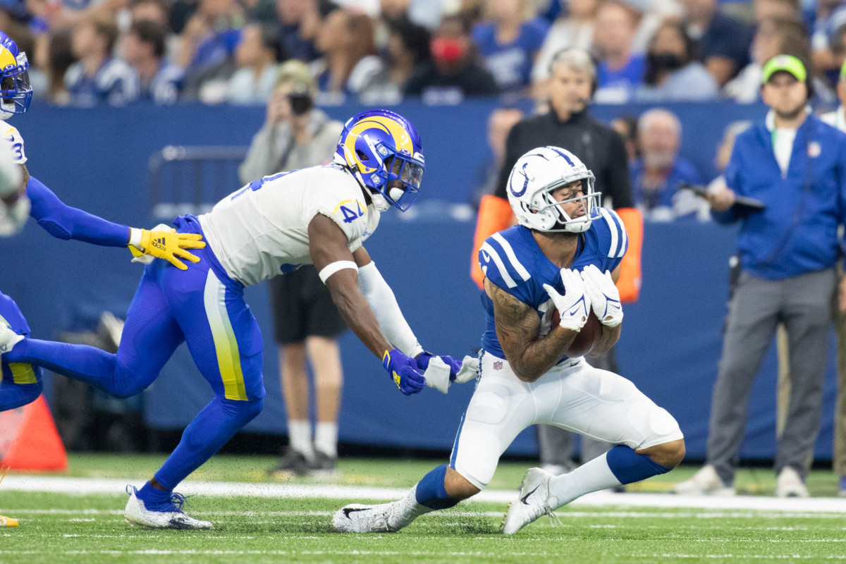 Sep 19, 2021; Indianapolis, Indiana, USA; Indianapolis Colts wide receiver Michael Pittman (11) catches the ball while Los Angeles Rams safety Jordan Fuller (4) defends in the first quarter at Lucas Oil Stadium.