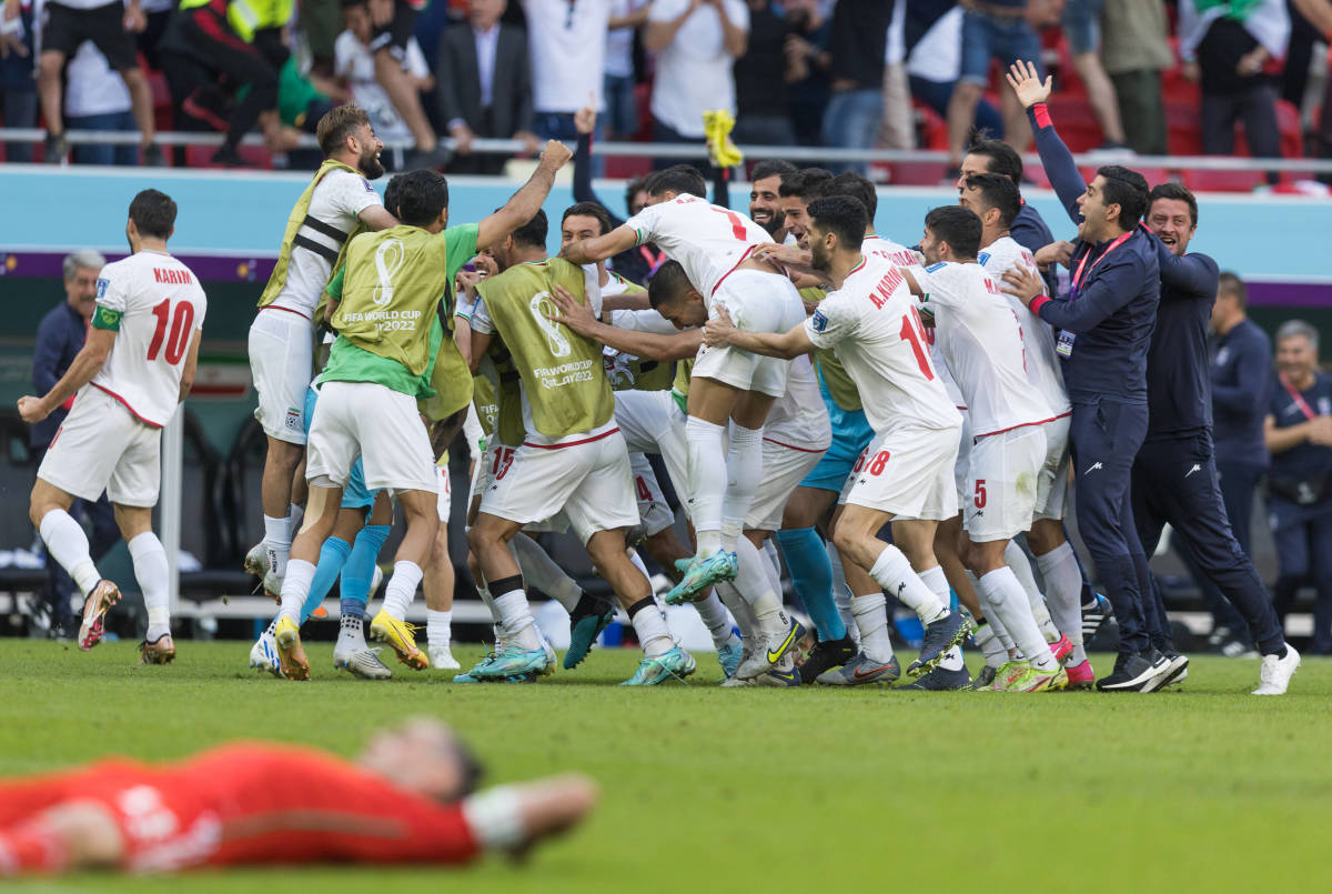 Iran's players pictured celebrating after beating Wales 2-0 in their second group game at the 2022 FIFA World Cup in Qatar