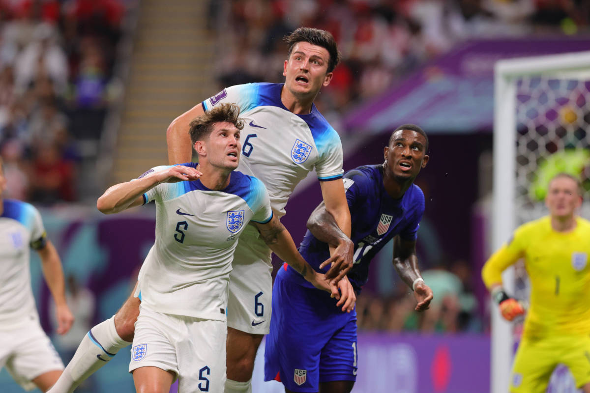 Harry Maguire pictured (center) jumping for a header during England's 0-0 draw with the USA at the 2022 FIFA World Cup