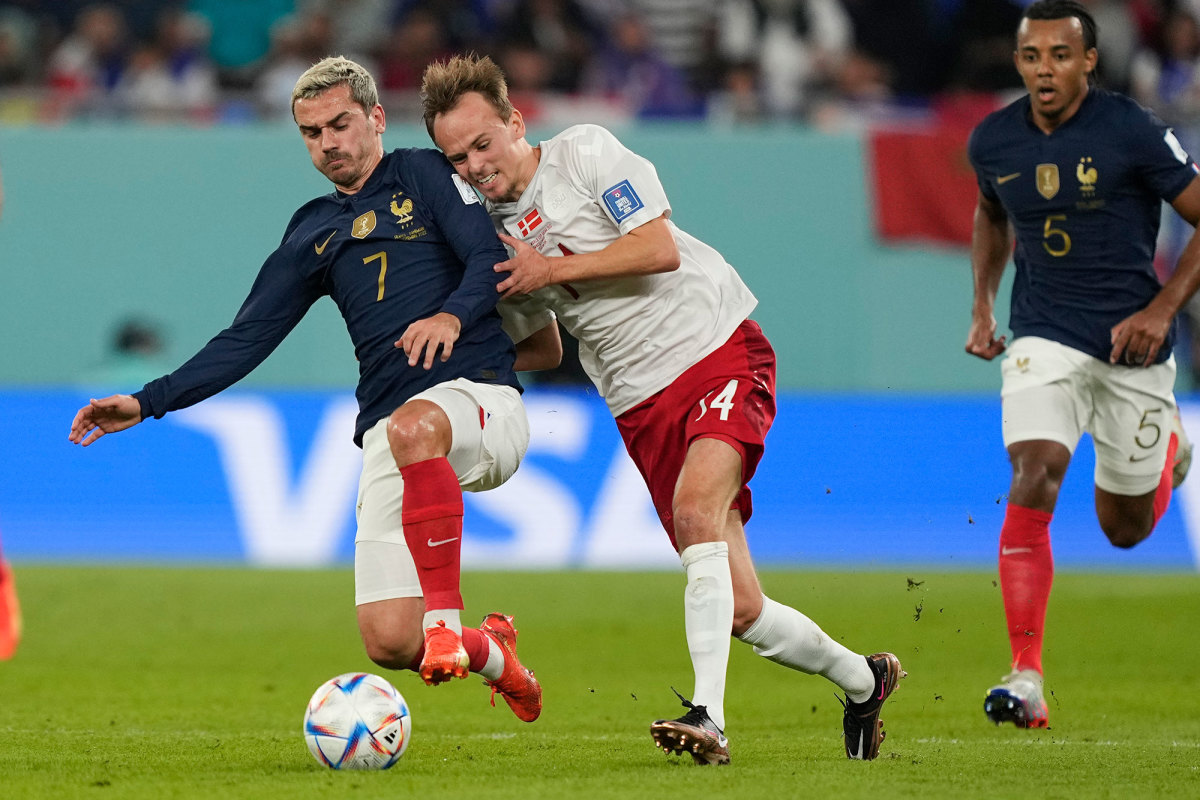 Antoine Griezmann makes a tackle for France against Denmark