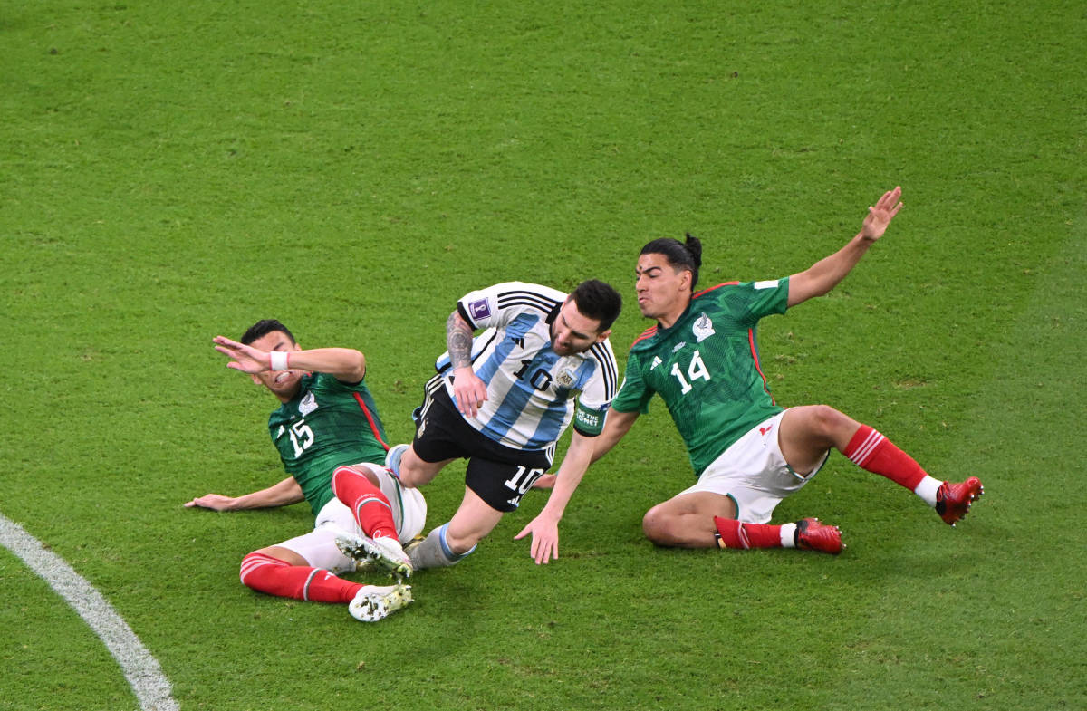 Lionel Messi pictured (center) in action for Argentina against Mexico at the 2022 FIFA World Cup in Qatar