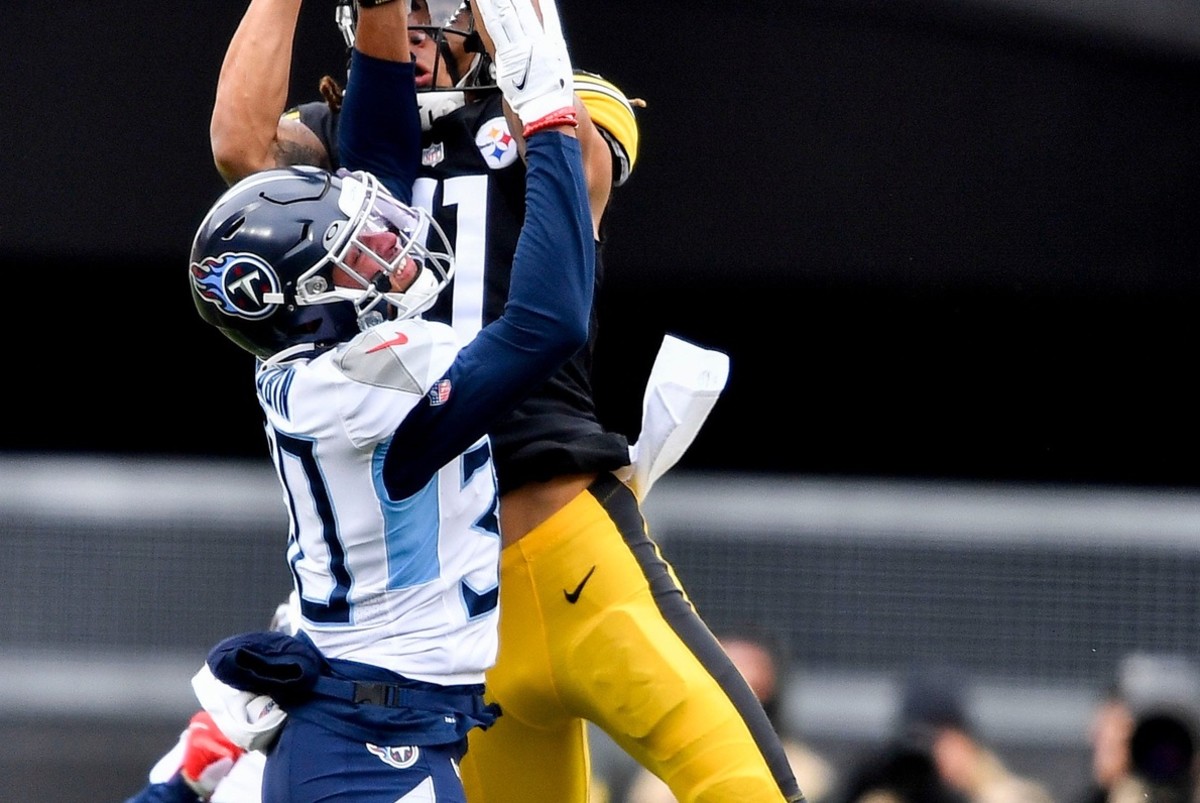 Tennessee Titans strong cornerback Greg Mabin (30) breaks up a pass intended for Pittsburgh Steelers wide receiver Chase Claypool (11) during the first quarter at Heinz Field Sunday, Dec. 19, 2021 in Pittsburgh, Pa.