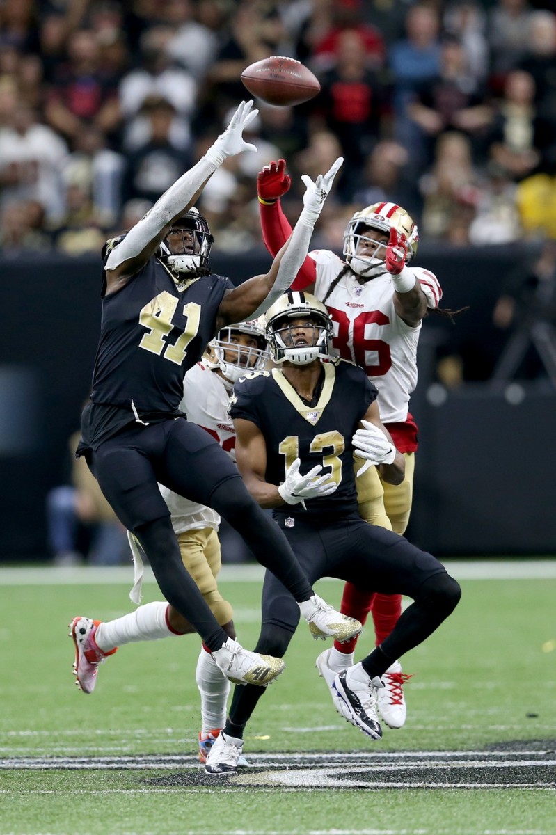 Dec 8, 2019; New Orleans Saints running back Alvin Kamara (41) and wide receiver Michael Thomas (13) reaches for a pass against the San Francisco 49ers. Mandatory Credit: Chuck Cook-USA TODAY