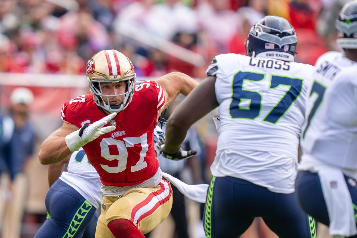 San Francisco 49ers defensive end Nick Bosa (97) rushes against Seattle Seahawks offensive tackle Charles Cross (67). Mandatory Credit: Kyle Terada-USA TODAY Sports