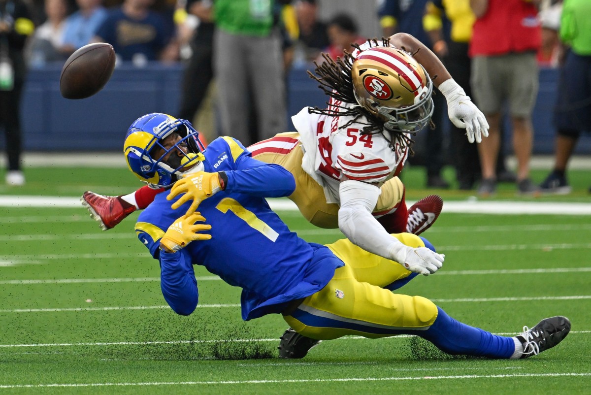 San Francisco 49ers linebacker Fred Warner (54) breaks up a pass to Los Angeles Rams wide receiver Allen Robinson II (1). Mandatory Credit: Robert Hanashiro-USA TODAY Sports
