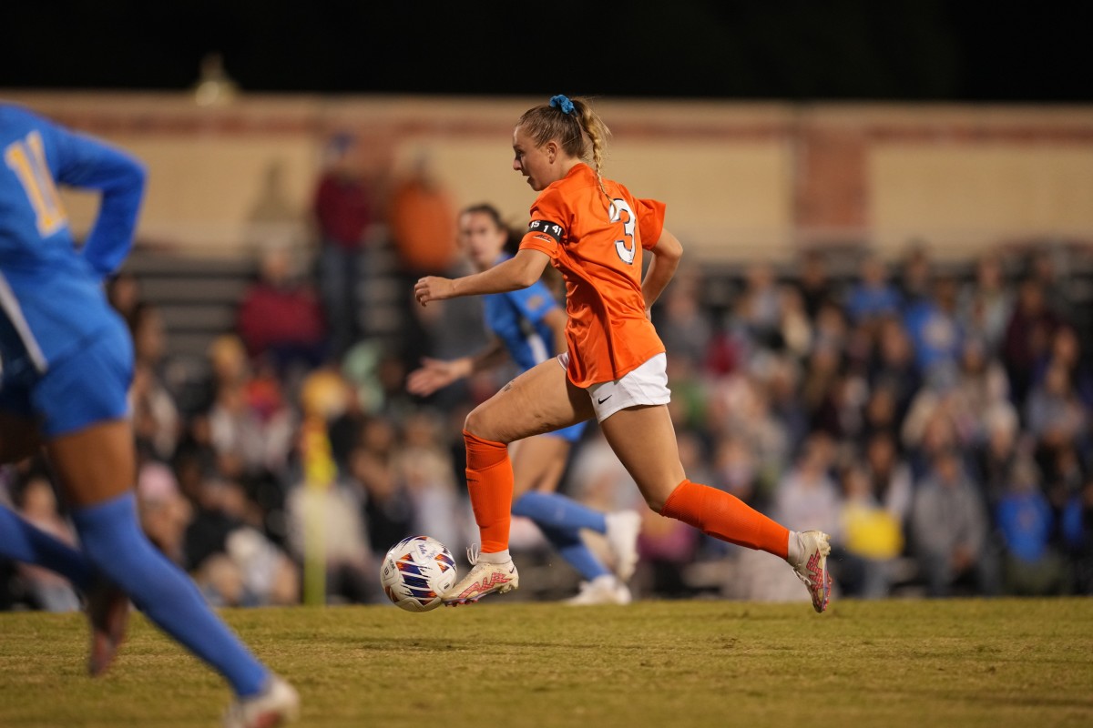 Alexis Theoret dribbles the ball forward during the Virginia women's soccer NCAA quarterfinal match at UCLA.