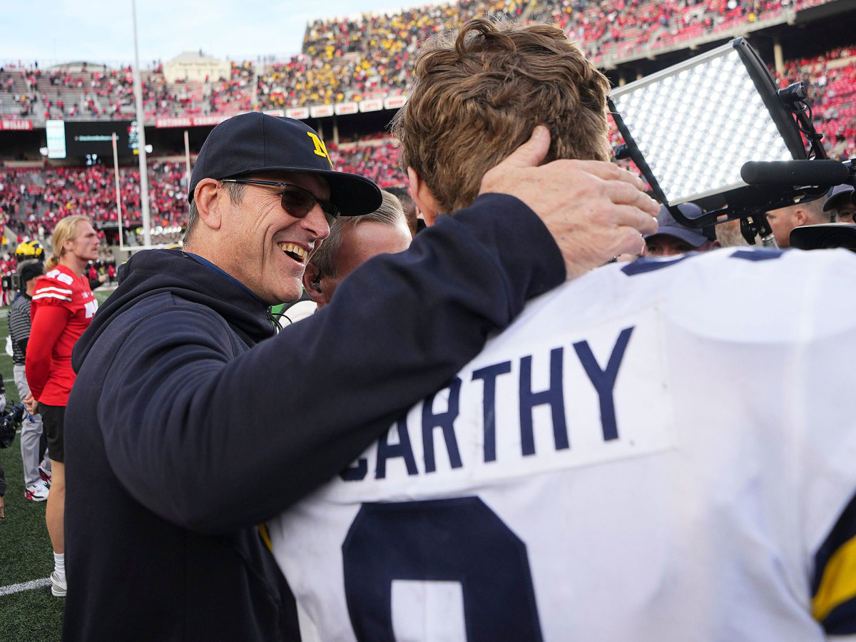 Jim Harbaugh embraces J.J. McCarthy after Michigan’s win