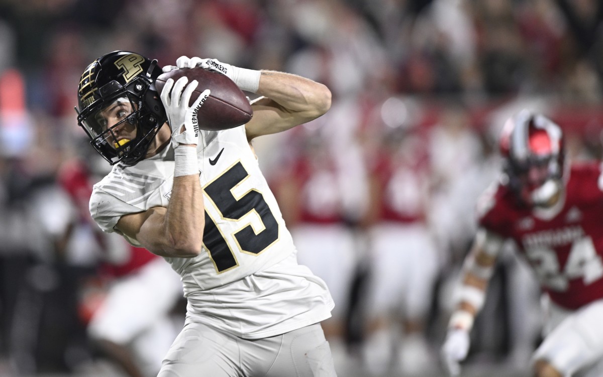 Nov 26, 2022; Bloomington, Indiana, USA; Purdue Boilermakers wide receiver Charlie Jones (15) catches a long pass for a touchdown against the Indiana Hoosiers during the second half at Memorial Stadium.