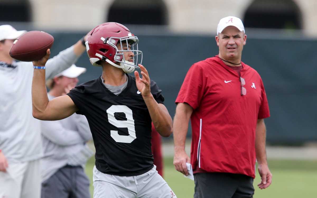 New offensive coordinator Bill O'Brien watches quarterback Bryce Young throw during practice. The Alabama Crimson Tide opened practice for the 2021 season as they prepare to defend the 2020 National Championship Friday