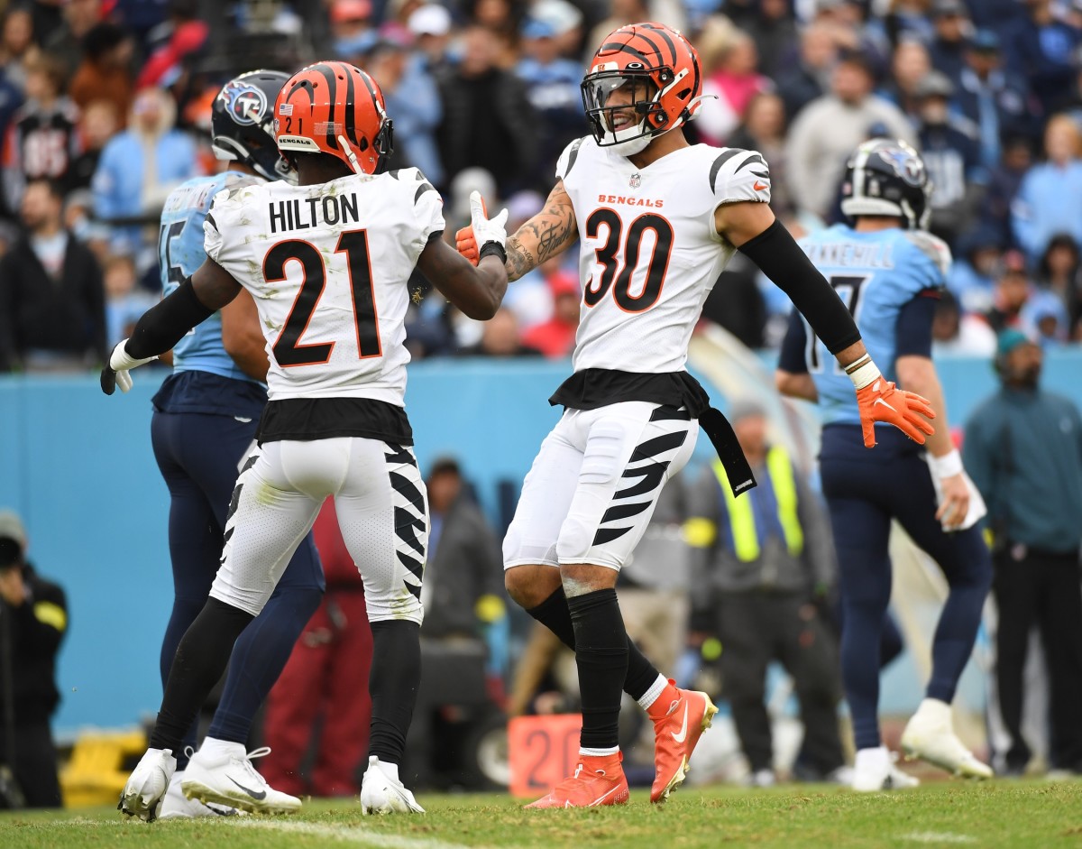 Nov 27, 2022; Nashville, Tennessee, USA; Cincinnati Bengals cornerback Mike Hilton (21) and safety Jessie Bates III (30) celebrate after a stop during the second half against the Tennessee Titans at Nissan Stadium. Mandatory Credit: Christopher Hanewinckel-USA TODAY Sports