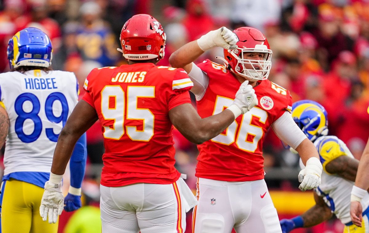 Nov 27, 2022; Kansas City, Missouri, USA; Kansas City Chiefs defensive end George Karlaftis (56) celebrates with defensive tackle Chris Jones (95) after a sack against the Los Angeles Rams during the first half at GEHA Field at Arrowhead Stadium. Mandatory Credit: Jay Biggerstaff-USA TODAY Sports
