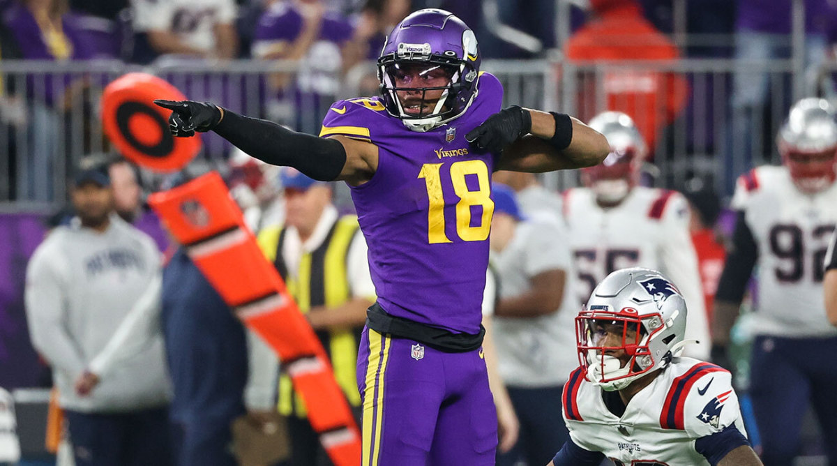 Vikings receiver Justin Jefferson signals first down after one of his nine catches against the Patriots in Week 12.