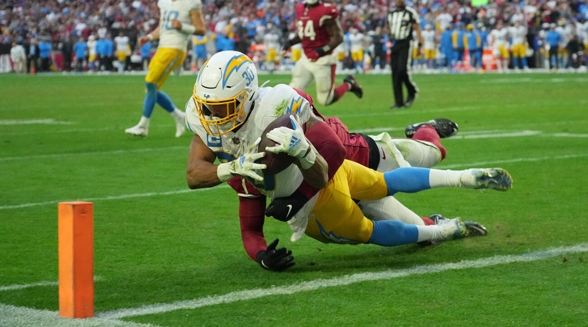 Chargers running back Austin Ekelers dives for the winning touchdown against the Cardinals in Week 12.