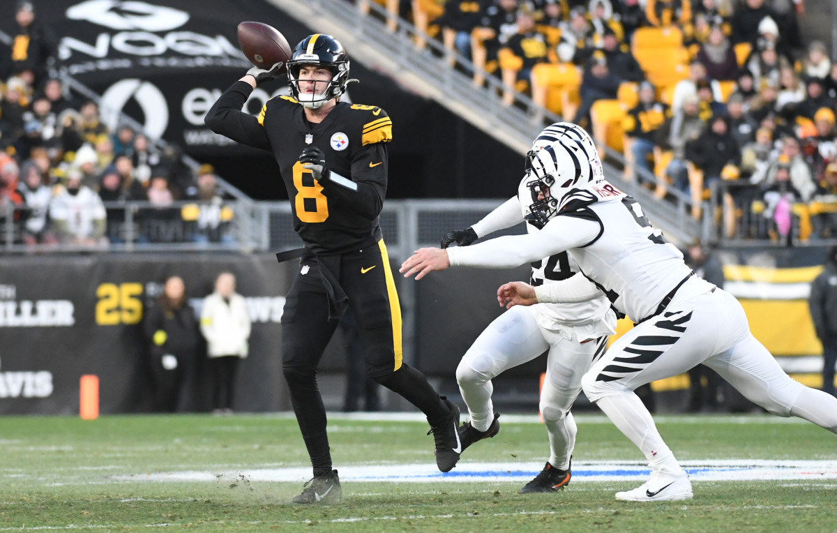 Nov 20, 2022; Pittsburgh, Pennsylvania, USA; Pittsburgh Steelers quarterback Kenny Pickett throws the ball under pressure from Cincinnati Bengals safety Vonn Bell (24) and defensive end Sam Hubbard (94) during the first quarter at Acrisure Stadium. Mandatory Credit: Philip G. Pavely-USA TODAY Sports