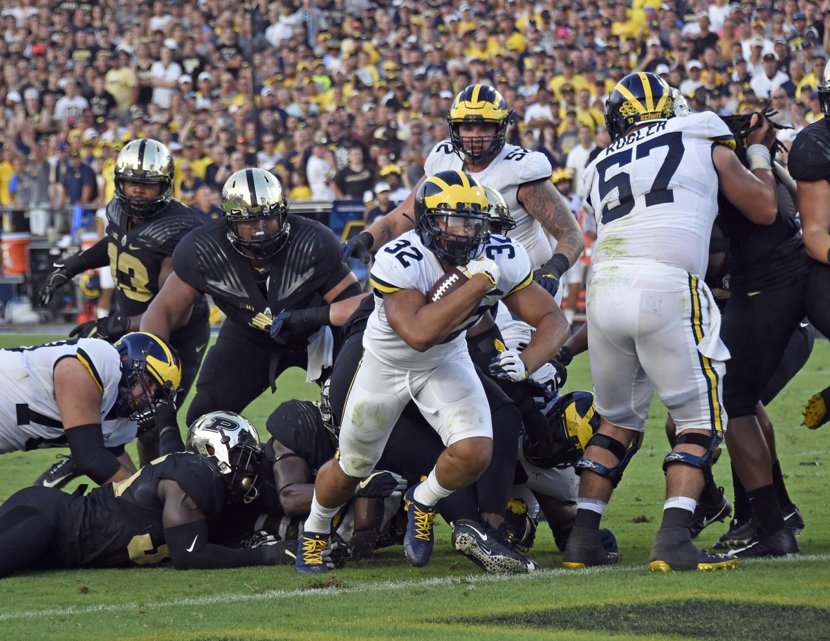 Sep 23, 2017; West Lafayette, IN, USA; Michigan Wolverines running back Ty Isaac (32) runs through the line for a touchdown against the Purdue Boilermakers in the 2nd half at Ross-Ade Stadium.