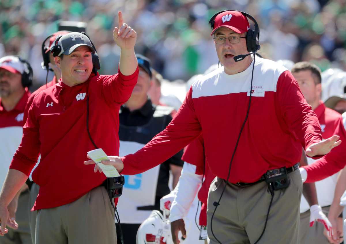 Wisconsin head coach Paul Chryst, right, and defensive coordinator Jim Leonhard argue in vain against a Notre Dame touchdown reception during the second quarter of their game Saturday, September 25, 2021 at Soldier Field in Chicago,